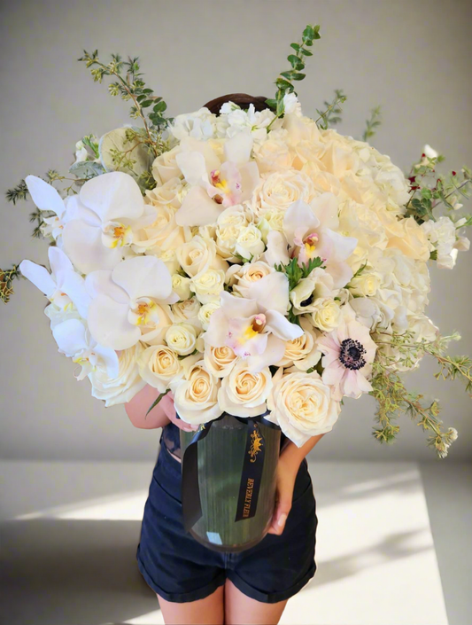 White Flower in glass vase suitable for sympathy 